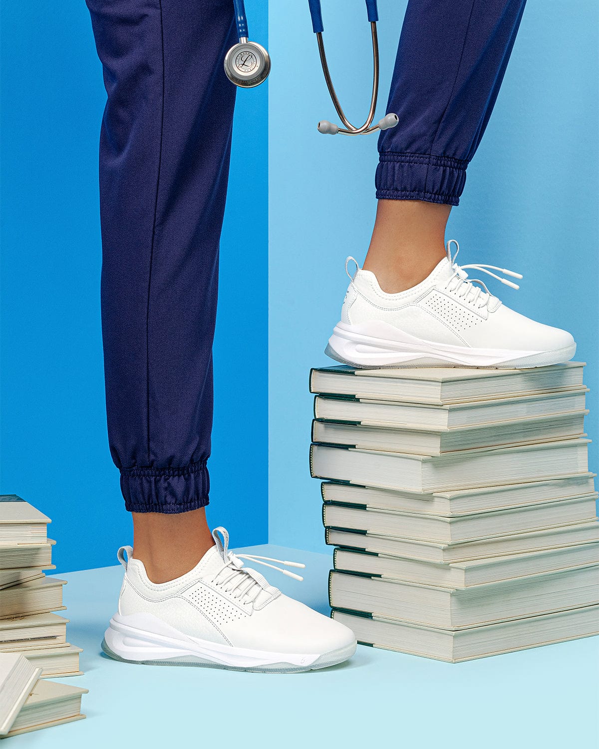 classic-brilliant-white-5_Model_Action_Shot_Books_Blue_Background_Doctor