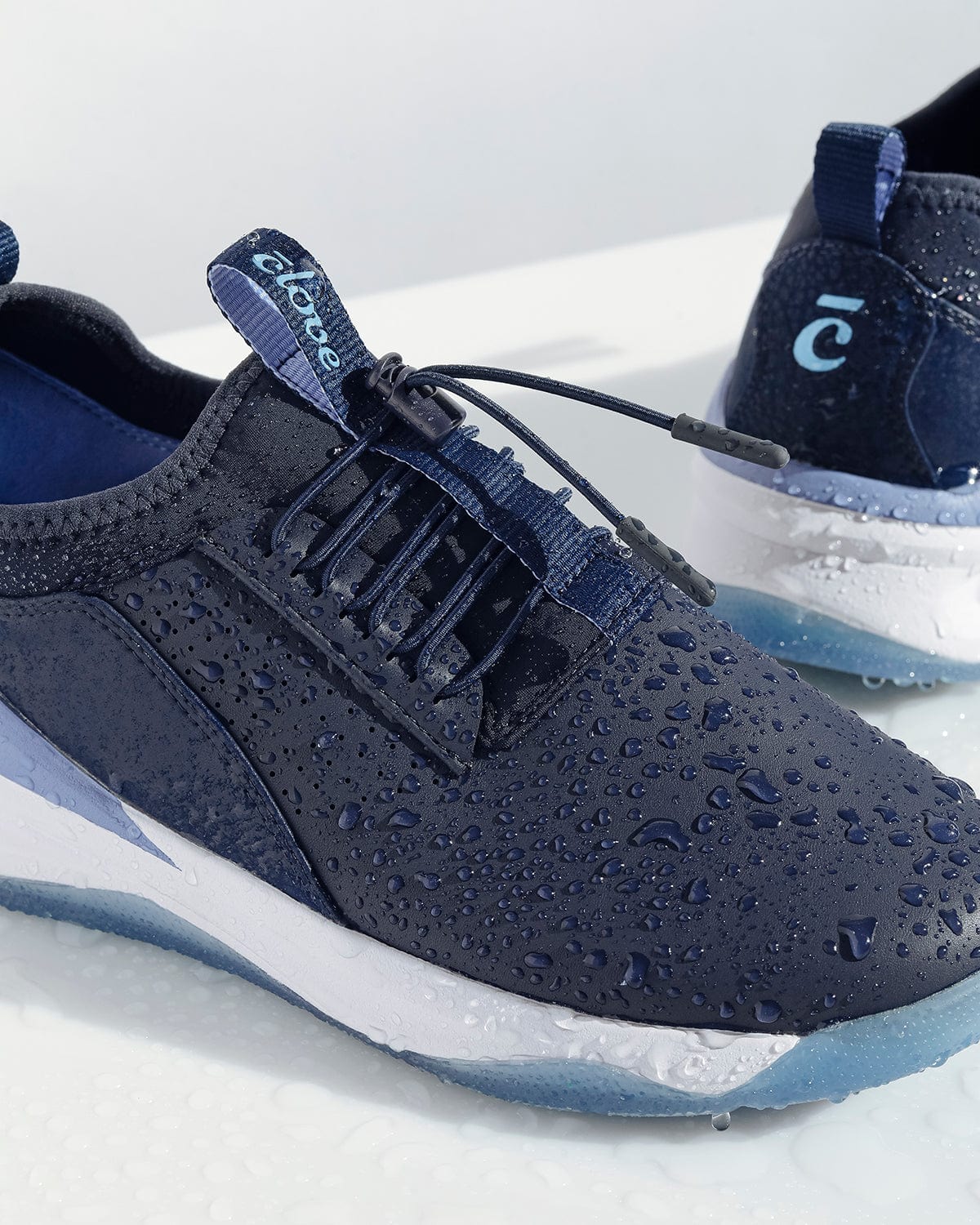 navy-carousel_Waterproof_Classic_Waterdrops_Action_Shot_Clarino_Material